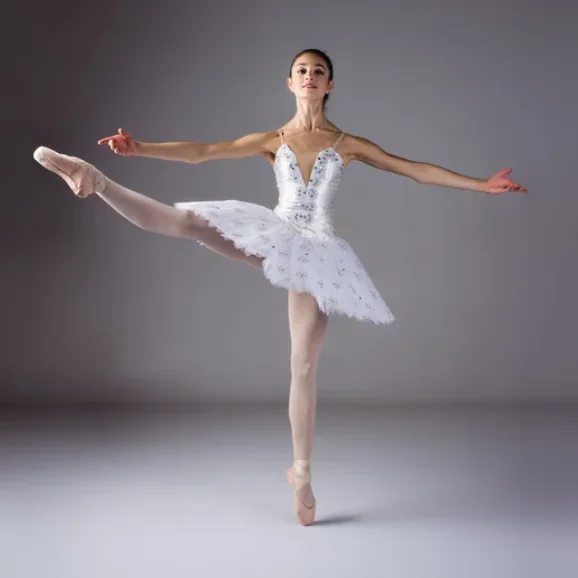 Ballerina en pointe in a white tutu at Hooked On Dance