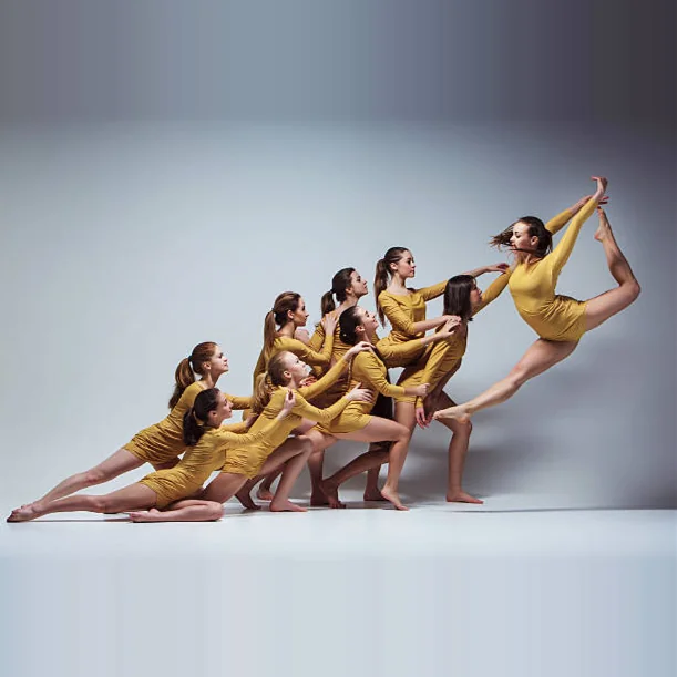 Modern dancers in a dynamic group formation